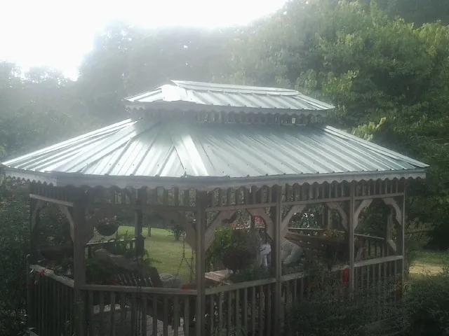 Two tier green metal roof on a garden gazebo in Hoosick Falls
